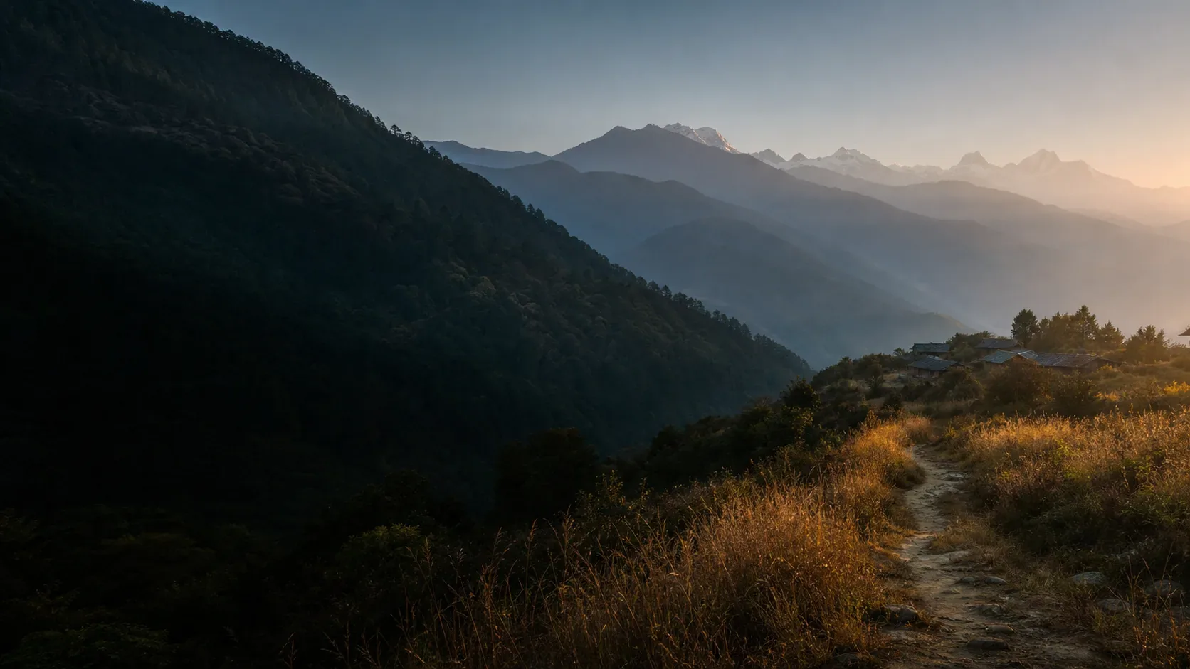 A trail above a Himalayan valley at dawn